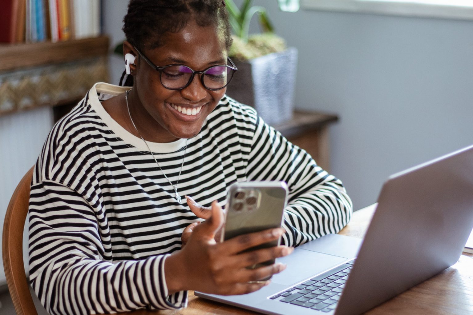 An overseas buyer reviewing a Jamaica property purchase on a laptop